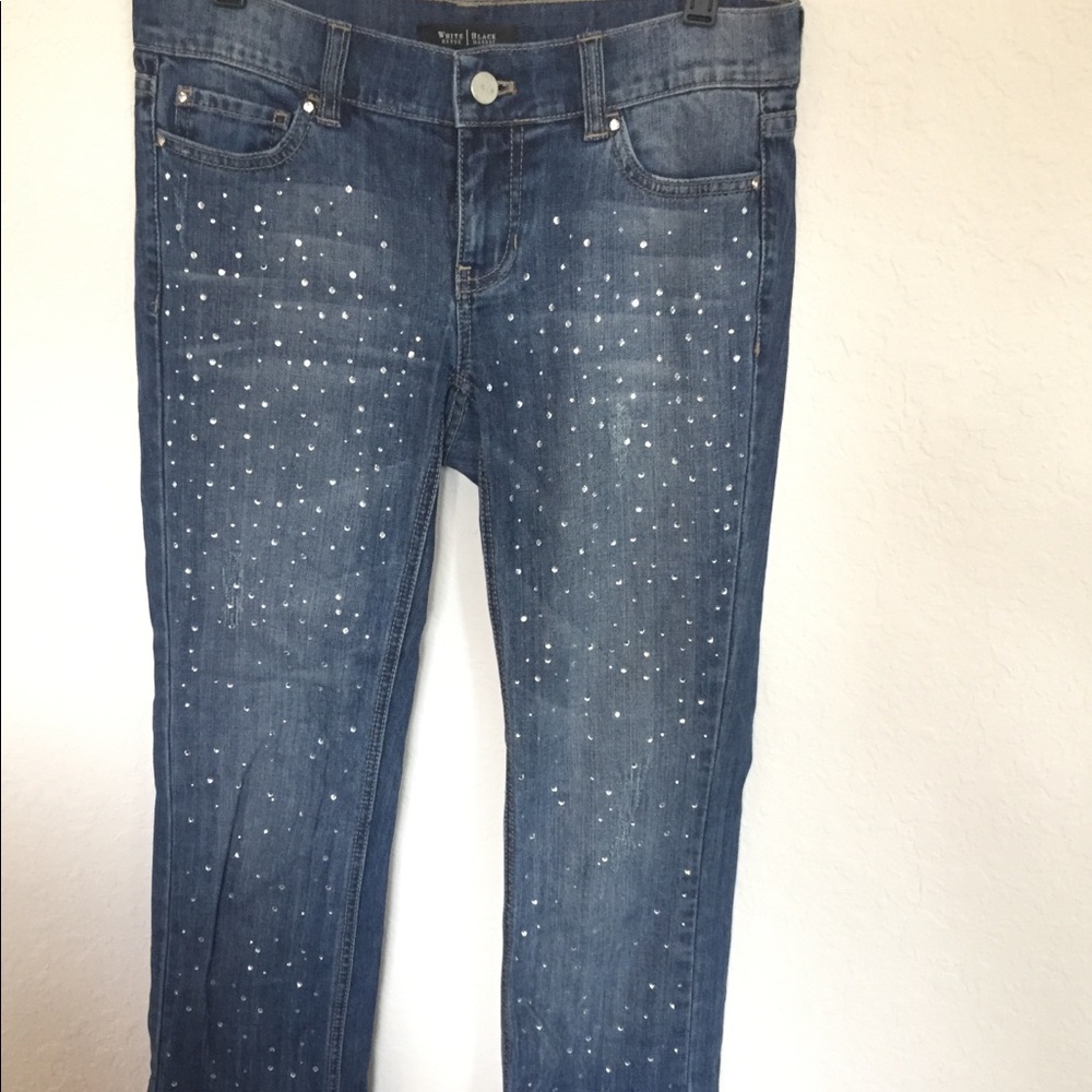 Crop jeans with rhinestones on the front.